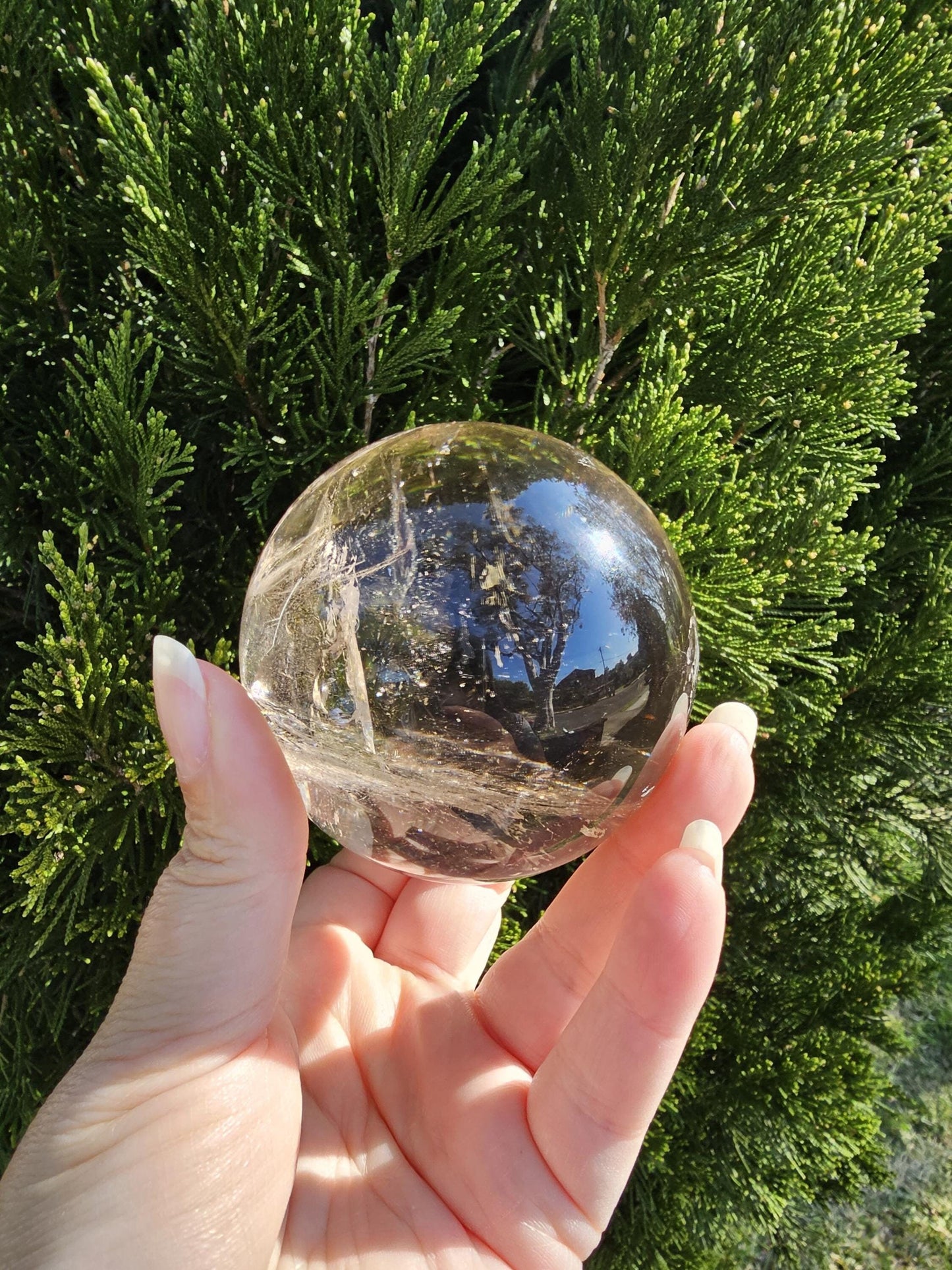 large smokey quartz sphere with rainbows