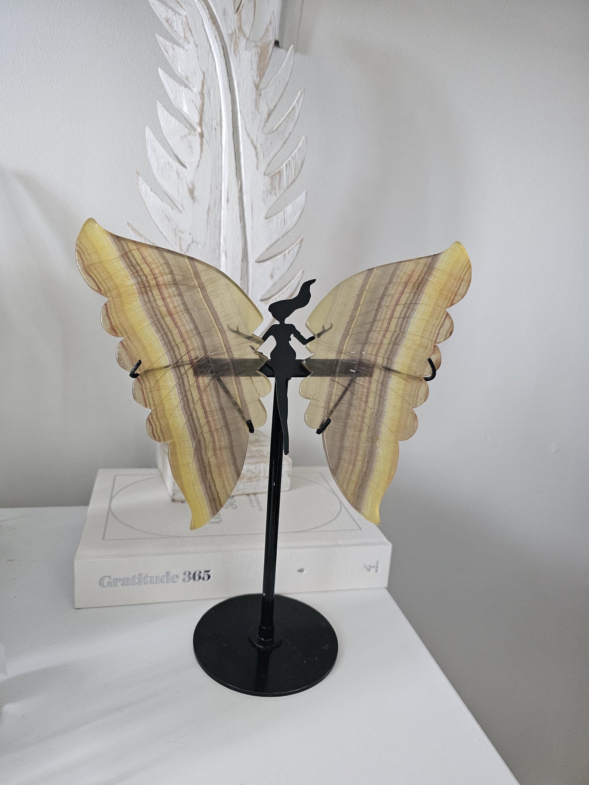 Yellow fluorite butterfly wings on stand