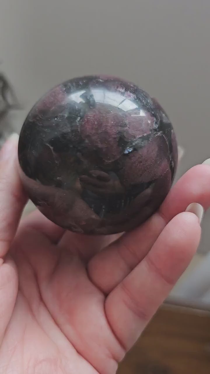 Garnet Sphere with Astrophylite / Arfvedsonite 6.5cm